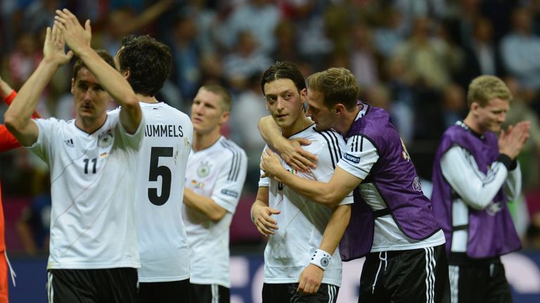 German midfielder Mesut Ozil (C)  reacts at the end of the Euro 2012 football championships semi-final match Germany vs Italy on June 28, 2012 at the Natio