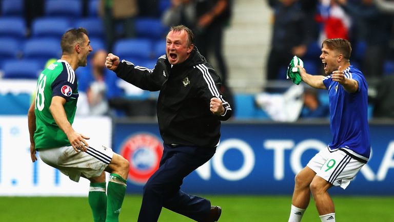 LYON, FRANCE - JUNE 16: Michael O'Neill (C) manager of Northern Ireland celebrate his team's second goal with Aaron Hughes (L) and Jamie Ward (R) during th