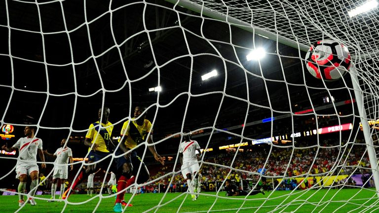 Ecuador's Miller Bolanos (c) scores against Peru 