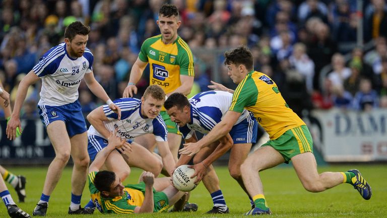 Martin Reilly of Donegal, assisted by Eoin McHugh, in action against Owen Duffy, Colm Walshe and Ryan Wylie of Monaghan at Kingspan Breffni Park in Cavan.