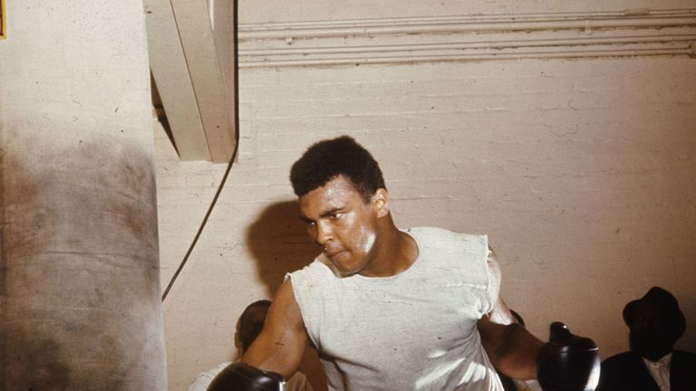 Muhammad Ali working the heavy bag in London, 1966