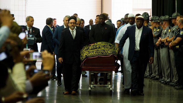 Pallbearers escort the casket of boxing legend Muhammad Ali during the Jenazah prayer service