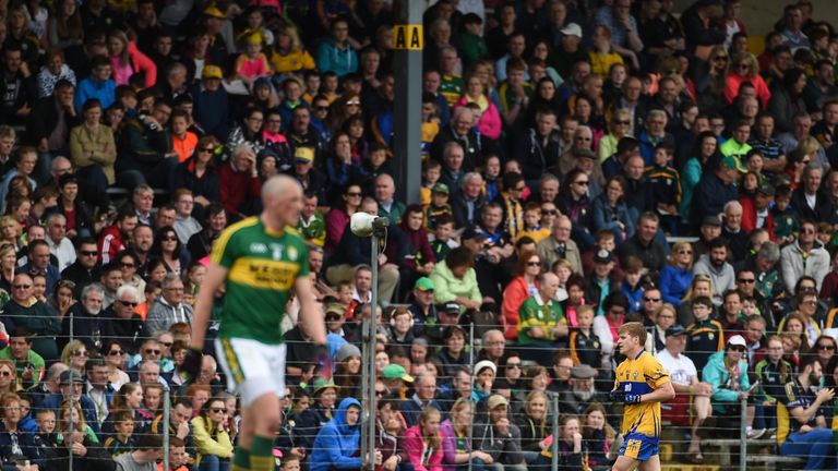 Padraic Collins of Clare leaves the pitch after being shown a black card by referee Fergal Kelly