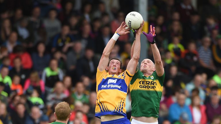 Cathal O'Connor of Clare in action against Kieran Donaghy of Kerry 