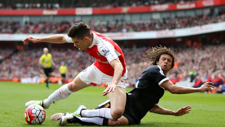 Ake challenges Arsenal's Gabriel