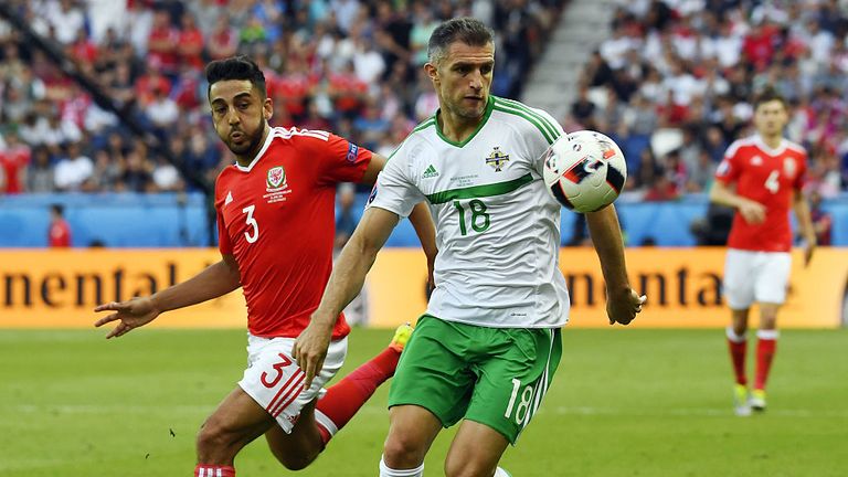 Wales' defender Neil Taylor (L) vies for the ball against Northern Ireland's defender Aaron Hughes during the Euro 2016 round of sixteen football match