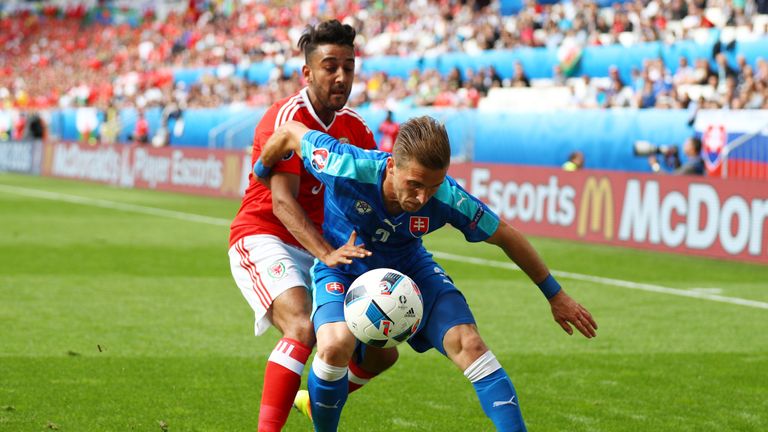 BORDEAUX, FRANCE - JUNE 11:  Peter Pekarik of Slovakia controls the ball under pressure of Neil Taylor of Wales during the UEFA EURO 2016 Group B match bet