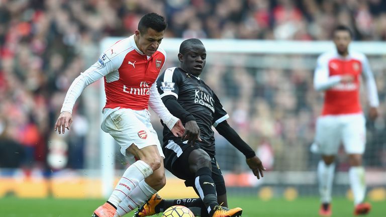 N'golo Kante of Leicester City tackles Alexis Sanchez