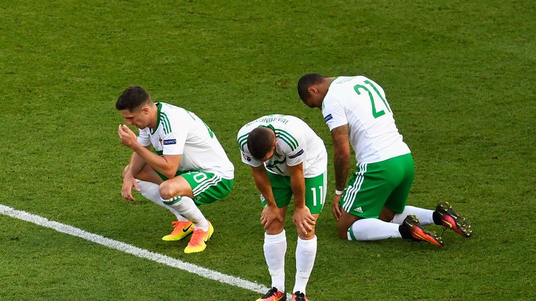 (L to R) Craig Cathcart, Conor Washington and Josh Magennis show their dejection after Northern Ireland's Euro 2016 exit