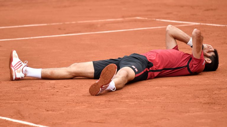 Serbia's Novak Djokovic celebrates after winning the men's final match against Britain's Andy Murray at the Roland Garros 2016 French Tennis Open in Paris 