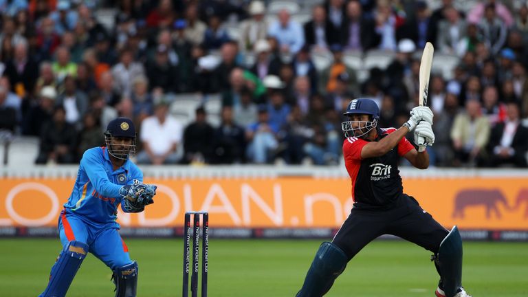 Ravi Bopara of England hits out as MS Dhoni of India watches from behind the stumps during the 4th Natwest ODI