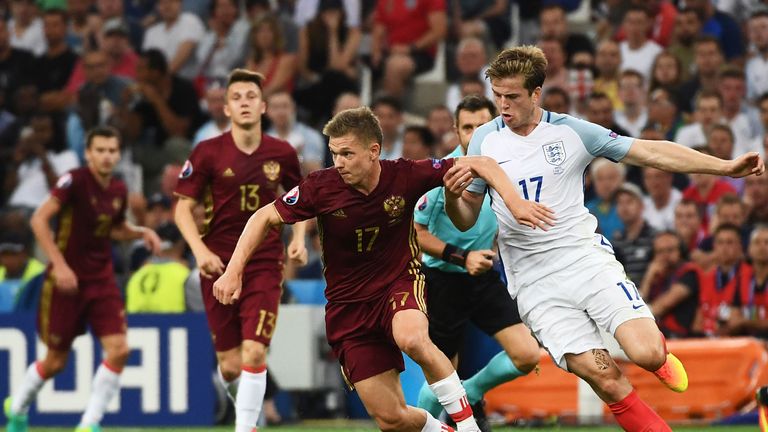 Russia's midfielder Oleg Shatov (C) is marked by England's midfielder Eric Dier (R) during the Euro 2016 group B football match between England and Russia 