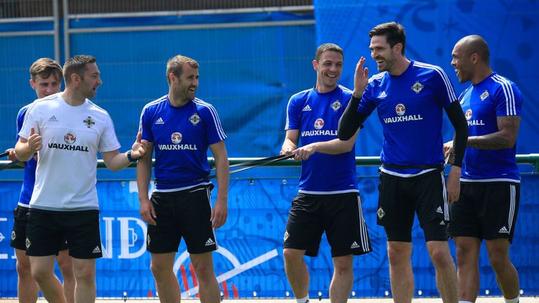 Northern Ireland's Kyle Lafftery (2nd Right) shares a joke with team mates during training at Parc de Montchervet