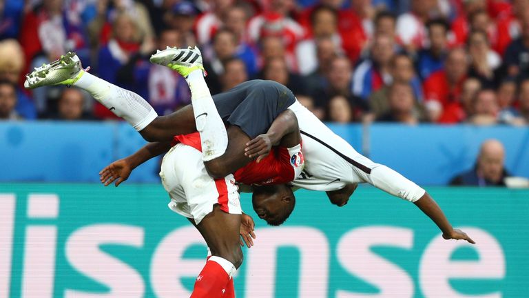 LILLE, FRANCE - JUNE 19:  Paul Pogba of France and Breel Embolo of Switzerland compete for the ball during the UEFA EURO 2016 Group A match between Switzer