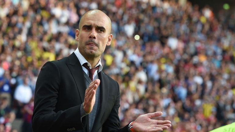 Bayern Munich's Spanish head coach Pep Guardiola applauds prior to the German Cup (DFB Pokal) final football match Bayern Munich vs Borussia Dortmund at th