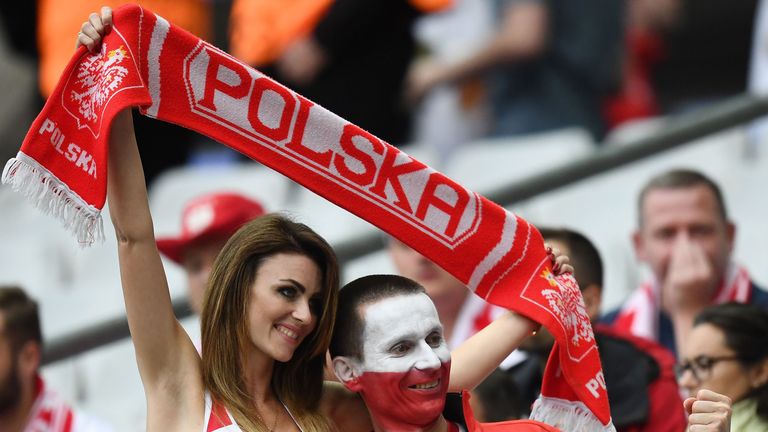 Poland supporters cheer for their team before the Euro 2016 group C football match between Germany and Poland at the Stade de France stadium in Saint-Denis