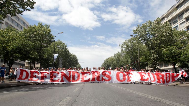 "Ultra" Poland supporters hold a banner reading "Defenders of European culture"
