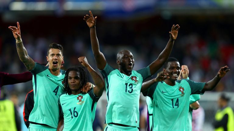 Portugal players celebrate at the end of extra-time