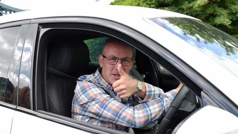 Rangers manager Mark Warburton gives a thumbs up as he arrives at Murray Park