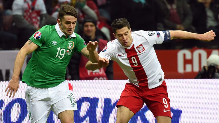 Ireland's midfielder Robbie Brady (L) and Polish striker Robert Lewandowski vie during the Euro 2016 Group D qualifying football match between Poland and t