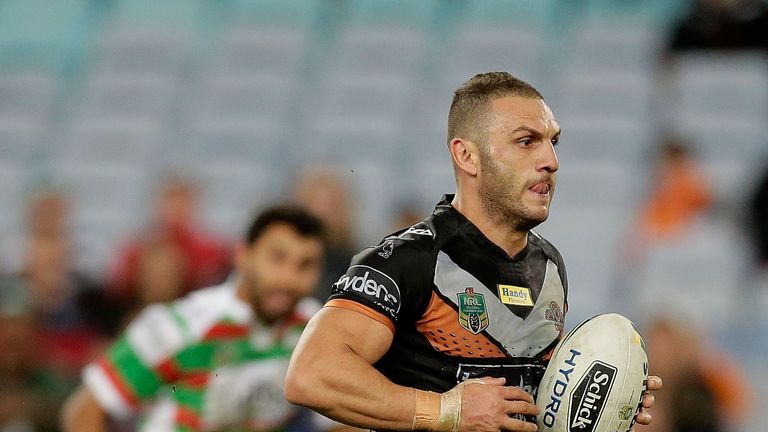   Robbie Farah  makes a break for the Wests Tigers 