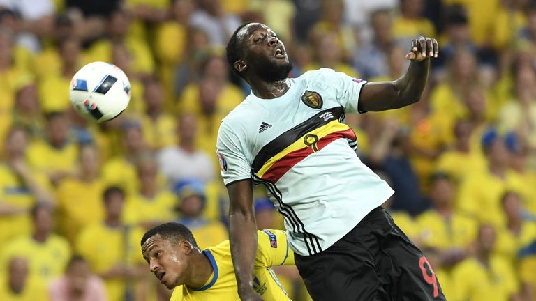 Belgium's forward Romelu Lukaku (R) vies with Sweden's defender Martin Olsson