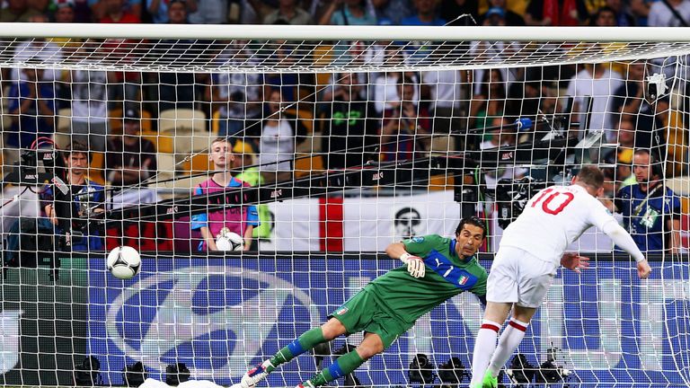 Rooney scores his penalty past Gianluigi Buffon of Italy at Euro 2012 