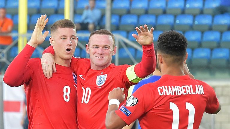 Ross Barkley (L) celebrates with Wayne Rooney and Alex Oxlade Chamberlain as England seal their Euro 2016 place with a win in San Marino