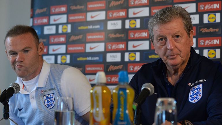 England's manager Roy Hodgson (R) and England's striker Wayne Rooney attend a press conference