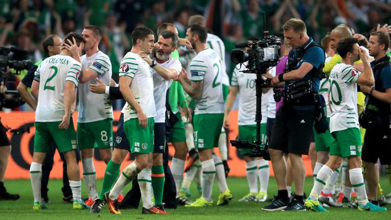 Republic of Ireland's Robbie Brady (left) is  manhandled by Roy Keane after his winner against Italy