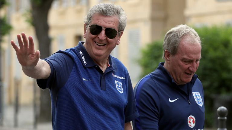 England coach Roy Hodgson (L) and England assistant coach Ray Lewington walk from the team hotel in Chantilly