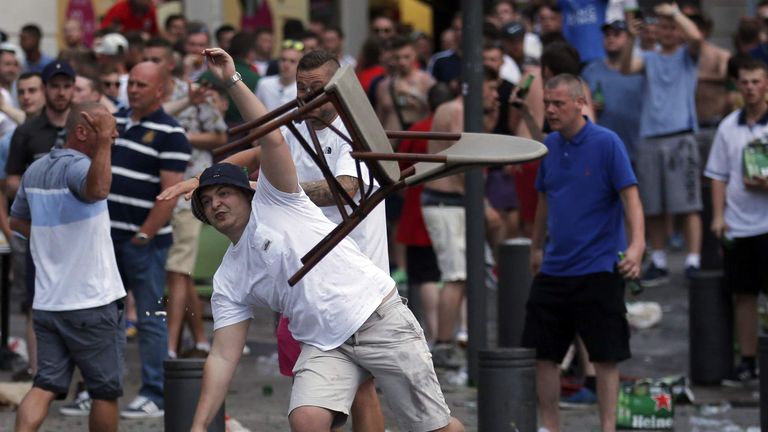 An England fan hurls a chair ahead of England's EURO 2016 match in Marseille