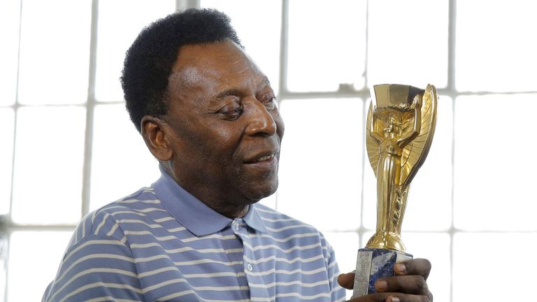 Pele with his 1958 World Cup replica trophy