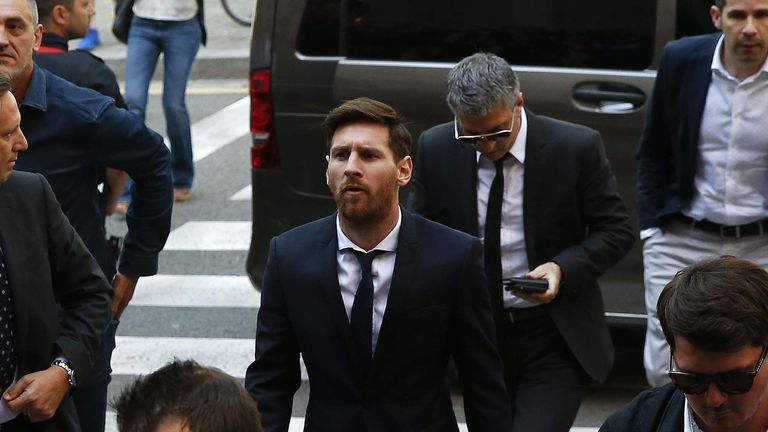 Barcelona's Argentine soccer player Lionel Messi arrives to court with his father Jorge Horacio Messi to stand trial for tax fraud in Barcelona