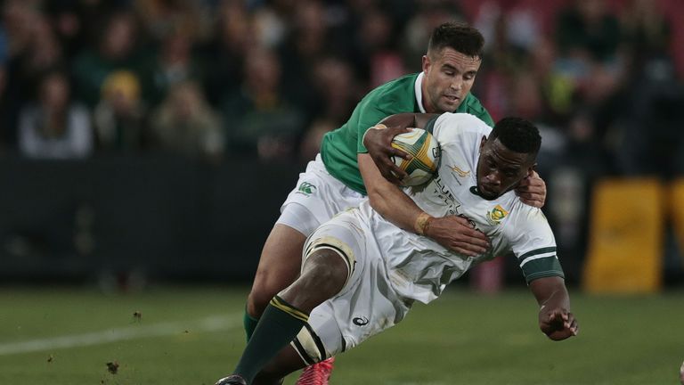 South Africa flanker Siya Kolisi (R) is tackled by Conor Murray during the second Test at Ellis Park