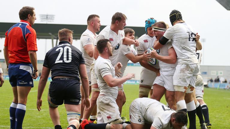 Jack Singleton (centre right) celebrates scoring a try against Scotland at the World Rugby U20 Championship