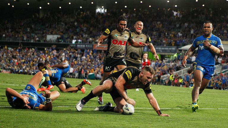 Bryce Cartwright of Penrith Panthers scores the winning try against Parramatta