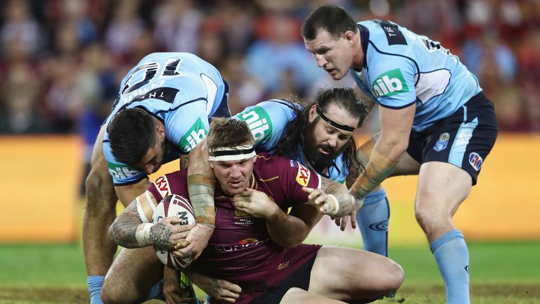 Queensland's Josh McGuire is tackled during game two of the State Of Origin 