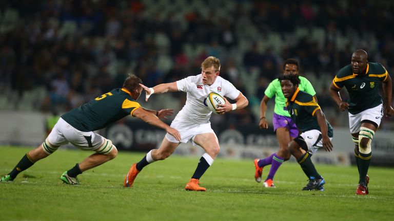 Dan Robson of the England Saxons looks to fend off Stephan Lewies of South Africa A