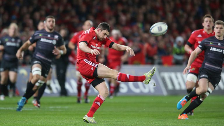 Felix Jones of Munster kicks the ball upfield during the European Rugby Champions Cup match between Munster and Saracens a