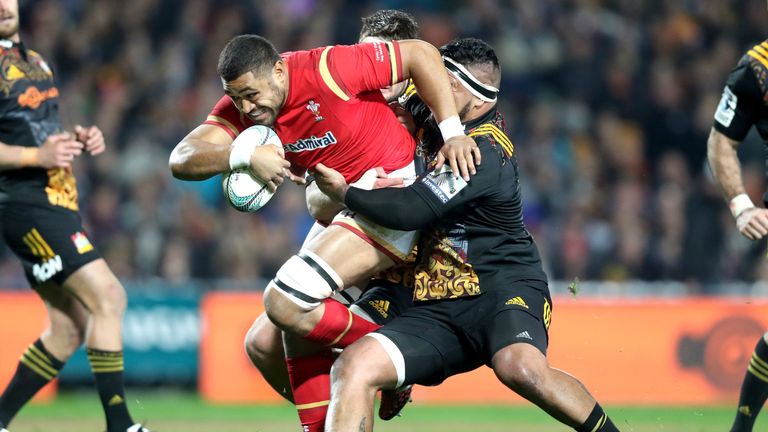 HAMILTON, NEW ZEALAND - JUNE 14:  Taulupe Faletau of Wales is tackled by Hika Elliot of the Chiefs during the International Test match against the Chiefs