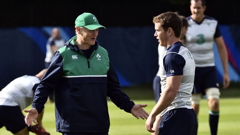 Ireland's head coach Joe Schmidt (L) talks to Ireland's scrum half Eoin Reddan (R) during a team training session in Newport, south Wales, on October 9, 20