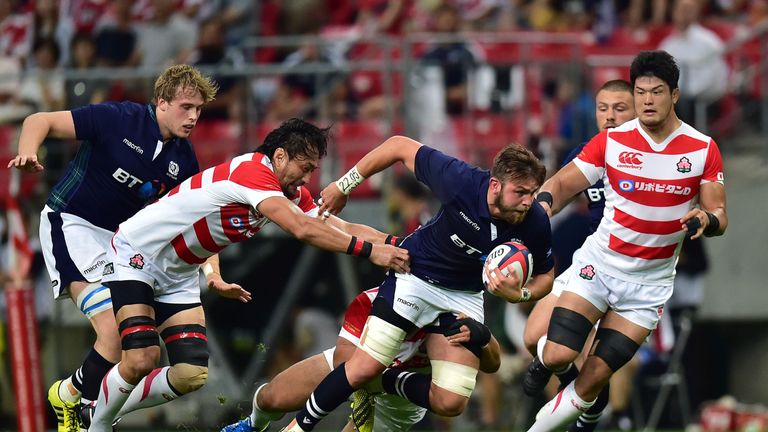 Ryan Wilson makes a break for Scotland at Toyota City