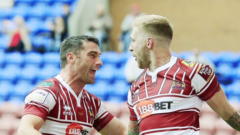 Sam Tomkins (right) celebrates his try against Castleford