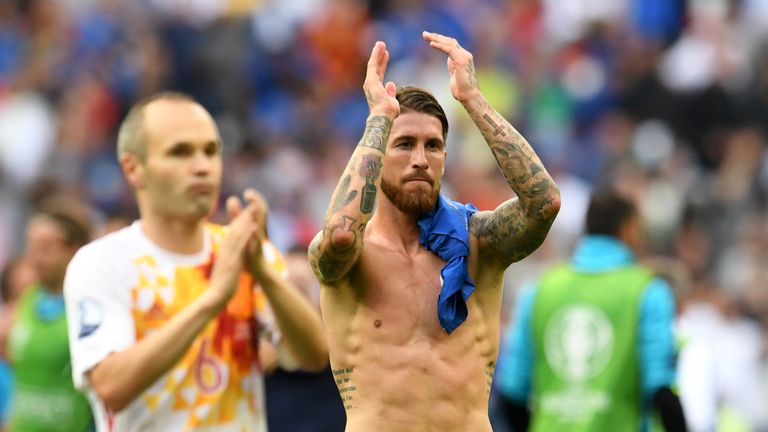 Sergio Ramos and Andres Iniesta (L) acknowledge the crowd after Spain's 2-0 defeat to Italy that saw them exit Euro 2016
