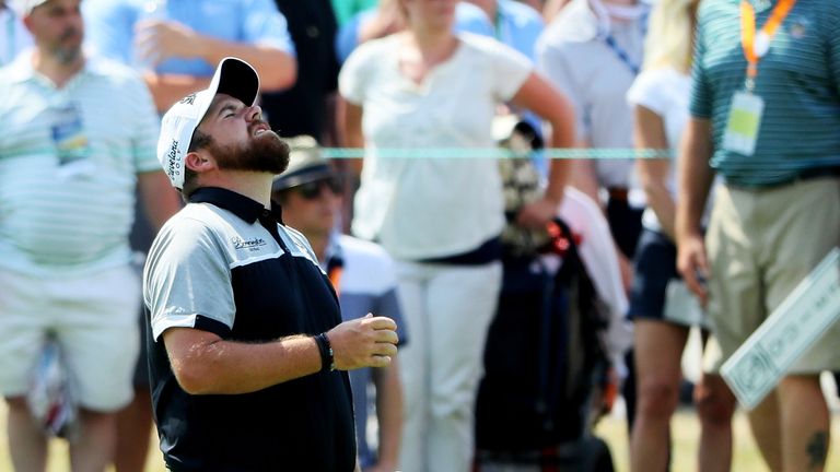Shane Lowry of Ireland reacts to his second shot on the second hole during the final round of the U.S. Open at Oakmont Country Club
