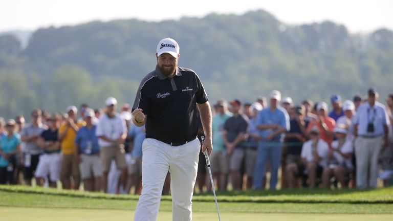 Shane Lowry, of Republic of Ireland, reacts after making a birdie on the 17th hole during the delayed third round of the U.S. Open golf championship at Oak