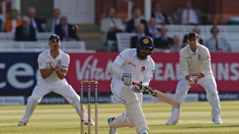 Sri Lanka's Dimuth Karunaratne hits a shot during play on the fourth day of the third test cricket match between England and Sri Lanka at Lord's cricket gr