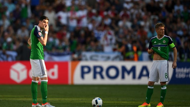 NICE, FRANCE - JUNE 12:  Kyle Lafferty (L) and Steven Davis (R) of Northern Ireland  show their dejection after Poland's first goal during the UEFA EURO 20