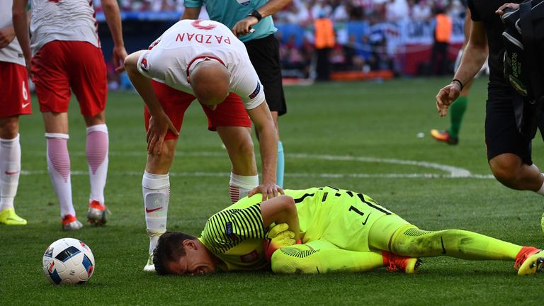 Wojciech Szczesny (down) suffered a thigh injury during Poland's 1-0 win over Northern Ireland